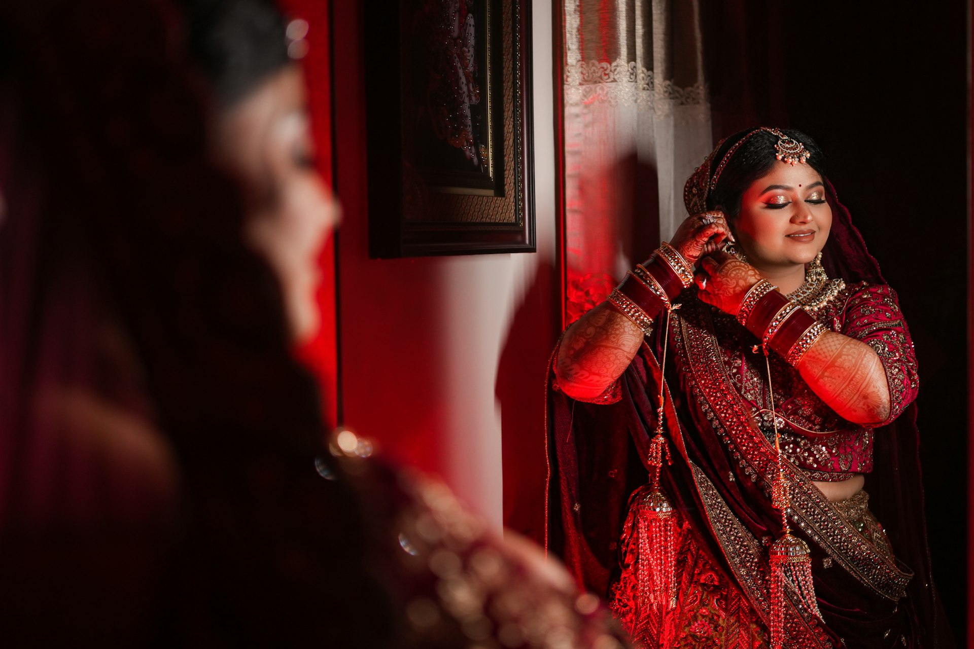 A woman standing in front of a mirror